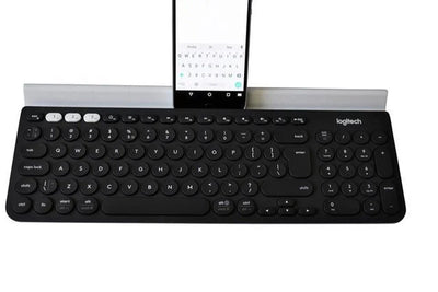 Draadloos toetsenbord met smartphonehouder, compatibel met PC, tablet en smartphone.